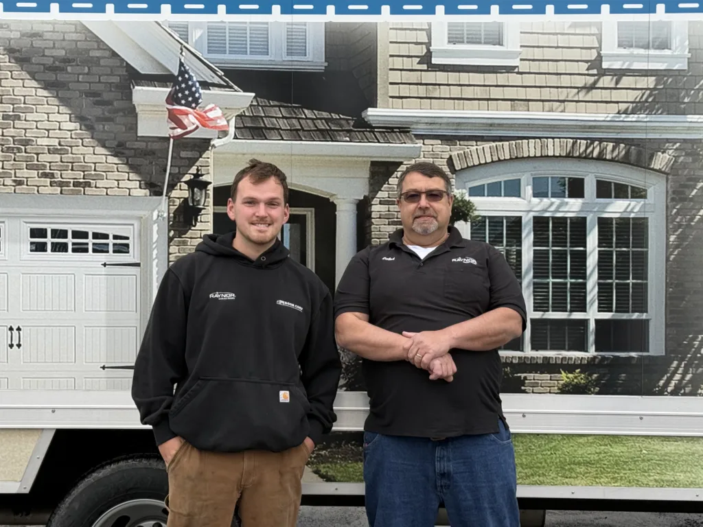 R&R Door Corp team with a garage door service truck